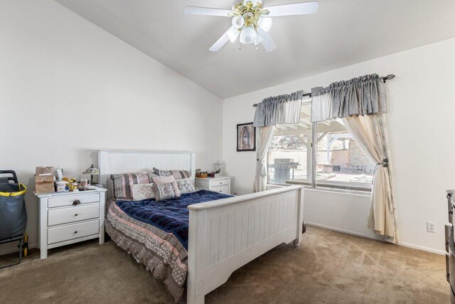 bedroom with baseboards, carpet, a ceiling fan, and lofted ceiling