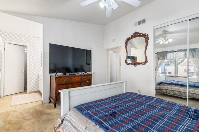 bedroom with visible vents, carpet flooring, a ceiling fan, and a closet