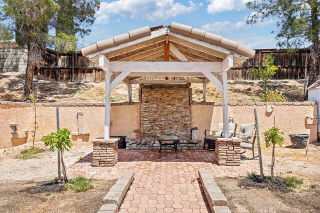 view of patio with a gazebo and a fenced backyard
