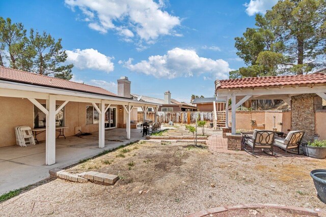view of yard with fence, stairs, and a patio area
