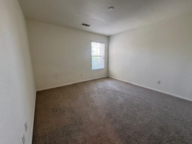 44316 Acacia St, Lancaster, CA 93535 - carpeted spare room with baseboards