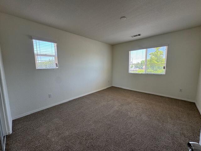 44316 Acacia St, Lancaster, CA 93535 - unfurnished room with healthy amount of natural light and carpet