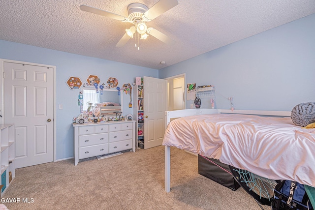 43840 Bobby Jones Dr Apt 22, Lancaster, CA 93536 - bedroom featuring a textured ceiling, light carpet, and ceiling fan