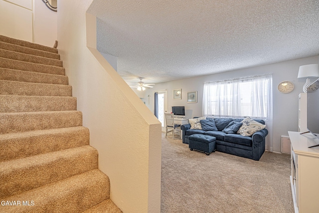 43840 Bobby Jones Dr Apt 22, Lancaster, CA 93536 - living area with a textured ceiling, light colored carpet, stairway, and a ceiling fan