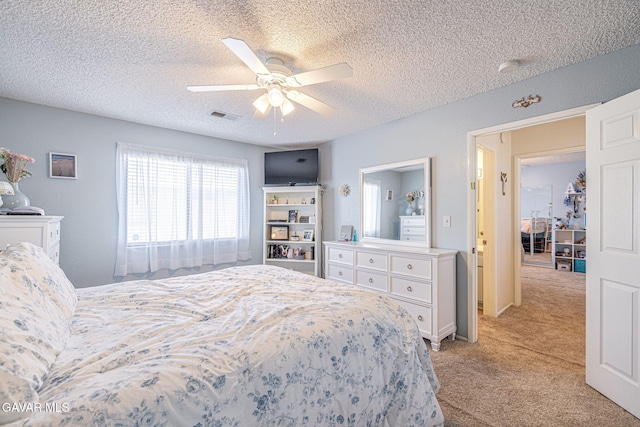 43840 Bobby Jones Dr Apt 22, Lancaster, CA 93536 - bedroom featuring light carpet, a textured ceiling, and a ceiling fan