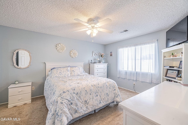 43840 Bobby Jones Dr Apt 22, Lancaster, CA 93536 - bedroom featuring light colored carpet, ceiling fan, and a textured ceiling