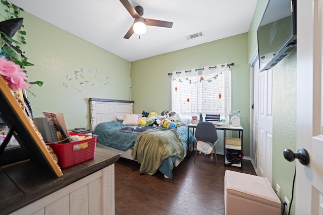 bedroom with dark hardwood / wood-style flooring, multiple windows, and ceiling fan