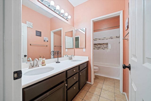 full bathroom with tiled shower / bath, tile patterned floors, toilet, and vanity