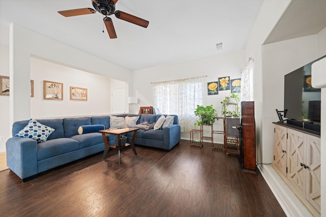 living room with dark hardwood / wood-style floors and ceiling fan