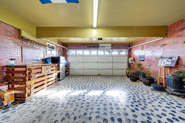 garage featuring stainless steel refrigerator