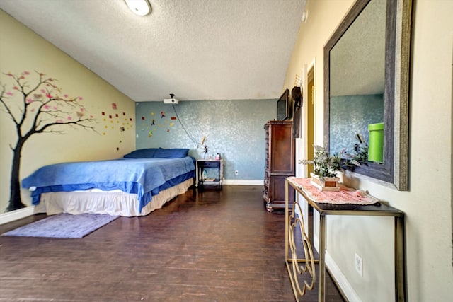 bedroom featuring a textured ceiling and dark wood-type flooring