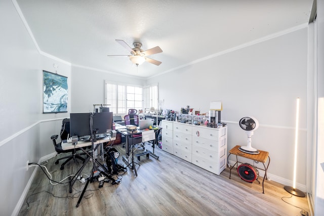 home office featuring ornamental molding, ceiling fan, and wood finished floors