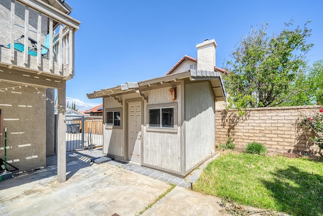 view of shed with fence