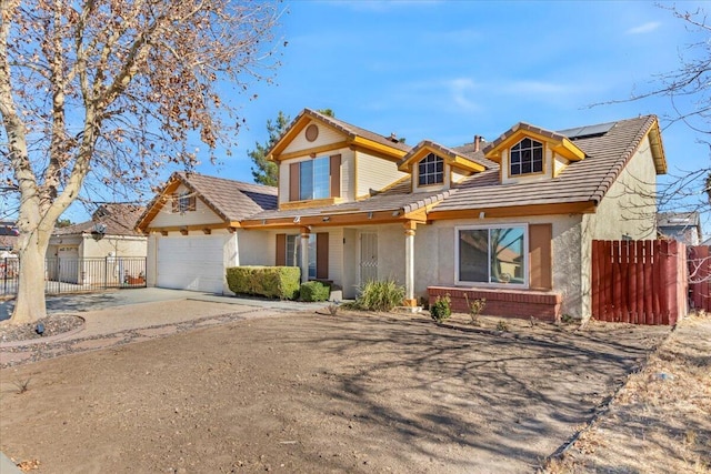 front facade featuring solar panels and a garage