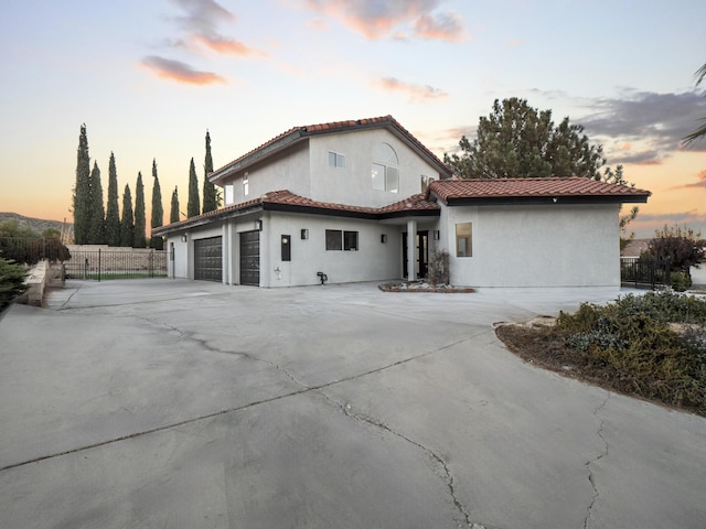 property exterior at dusk with a garage