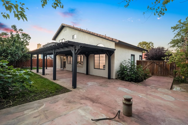 2012 Comstock Ct, Palmdale, CA 93551 - rear view of property with a patio, stucco siding, and a gate