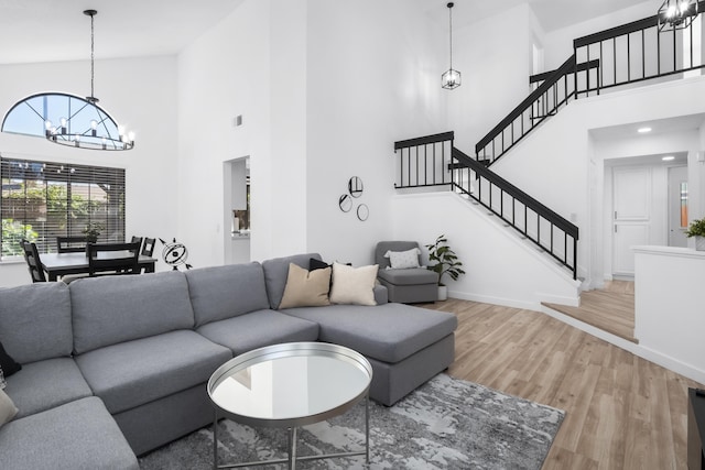 2012 Comstock Ct, Palmdale, CA 93551 - living area with a high ceiling, a chandelier, wood finished floors, stairway, and baseboards