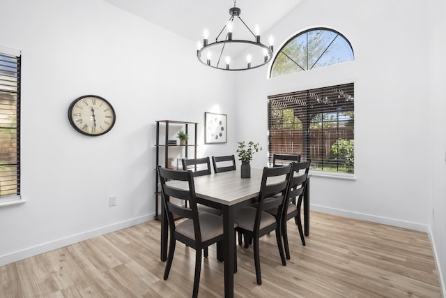 2012 Comstock Ct, Palmdale, CA 93551 - dining room featuring a chandelier, light wood-type flooring, high vaulted ceiling, and baseboards
