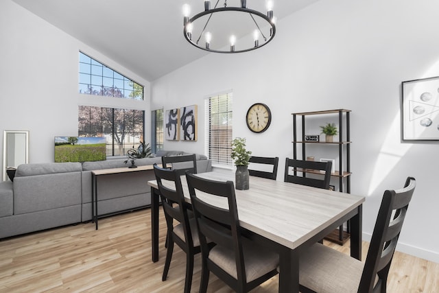 2012 Comstock Ct, Palmdale, CA 93551 - dining room with a chandelier, high vaulted ceiling, light wood finished floors, and baseboards
