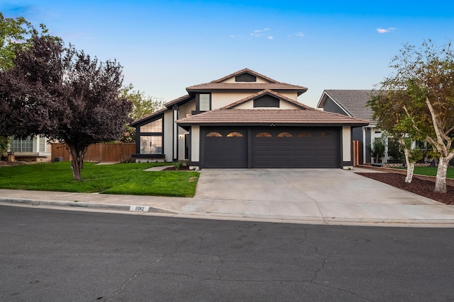 2012 Comstock Ct, Palmdale, CA 93551 - view of front of house featuring driveway, stucco siding, and an attached garage