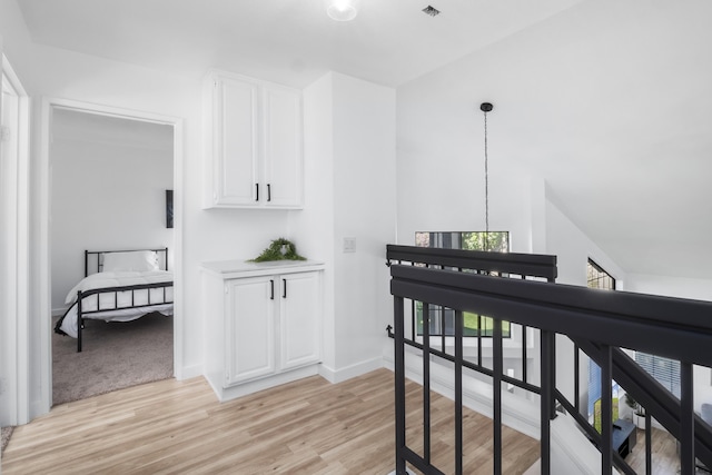 2012 Comstock Ct, Palmdale, CA 93551 - hall with light wood-style flooring, baseboards, and an upstairs landing
