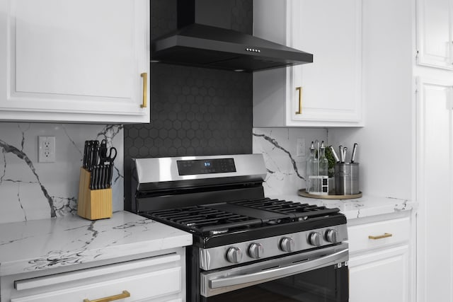 2012 Comstock Ct, Palmdale, CA 93551 - kitchen featuring stainless steel gas range oven, wall chimney range hood, tasteful backsplash, and white cabinets