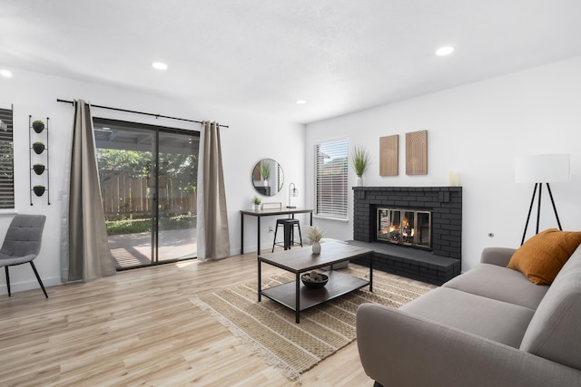 2012 Comstock Ct, Palmdale, CA 93551 - living room with wood finished floors, a brick fireplace, recessed lighting, and baseboards