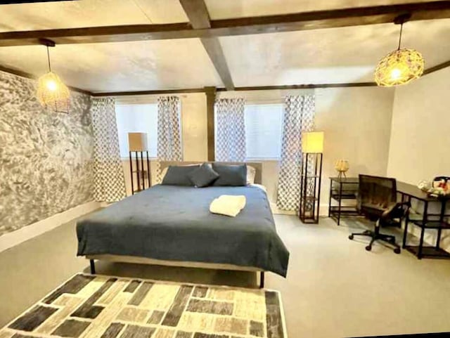 bedroom featuring carpet and beam ceiling