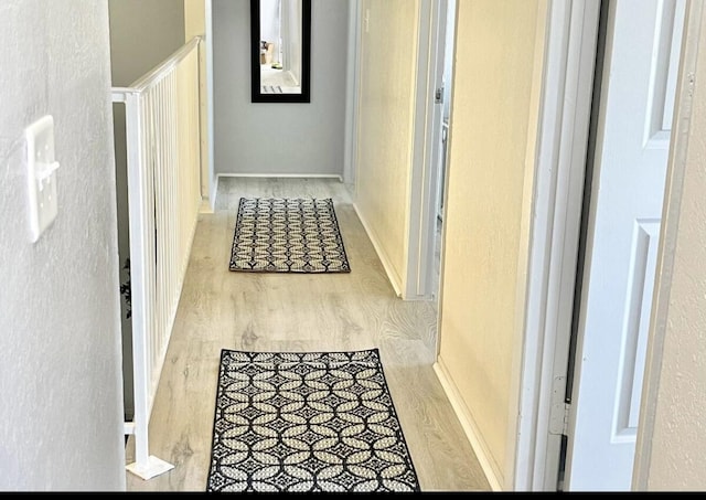 hallway featuring wood finished floors