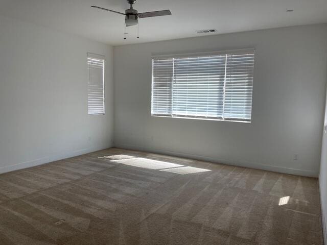 carpeted empty room with ceiling fan