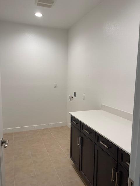 laundry room with light tile patterned floors