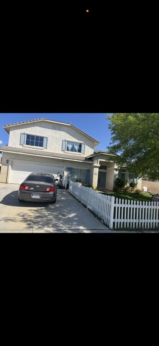 1761 W Blackberry Ct, Palmdale, CA 93551 - traditional-style house with driveway, stucco siding, and an attached garage