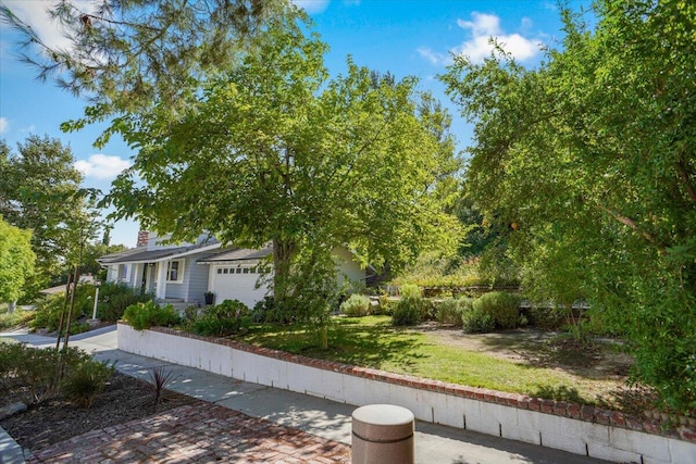 view of yard with a garage