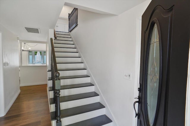 stairs with wood-type flooring