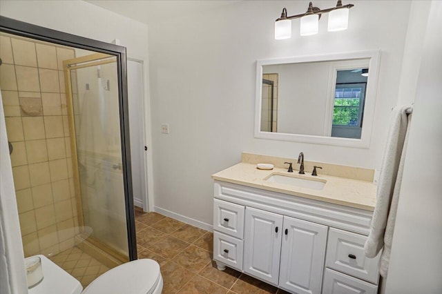 bathroom with toilet, a shower with door, tile patterned floors, and vanity