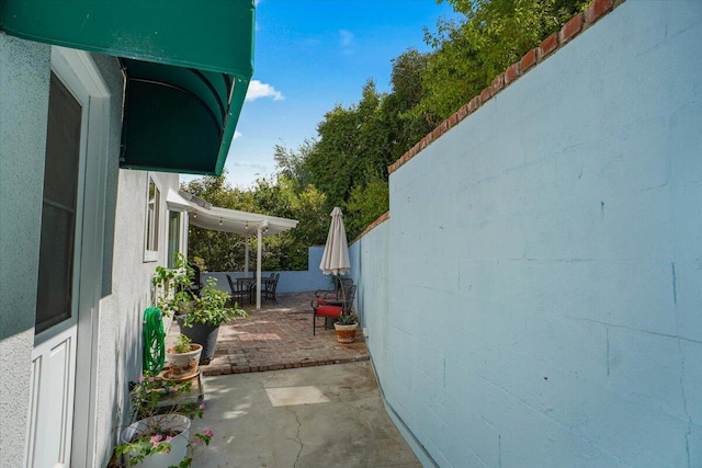 view of property exterior featuring a patio area