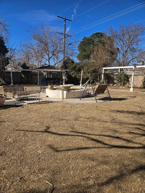 view of yard featuring playground community