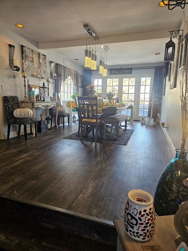 dining area with wood finished floors and visible vents