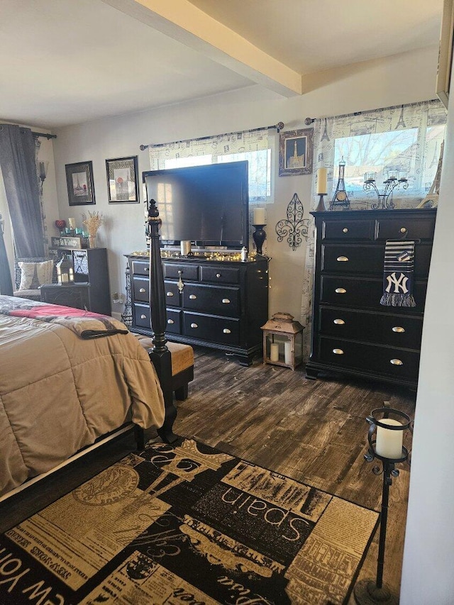 bedroom with dark wood finished floors