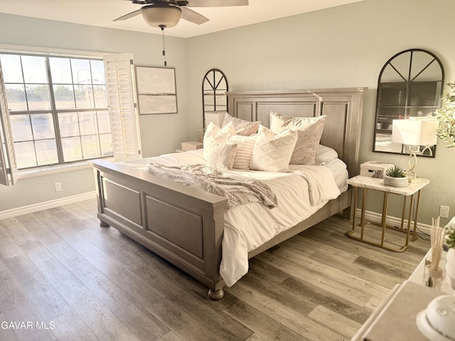 42821 W 15th St Unit 1, Lancaster, CA 93534 - bedroom with wood finished floors and a ceiling fan