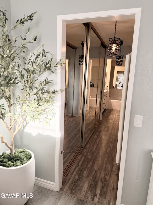 42821 W 15th St Unit 1, Lancaster, CA 93534 - corridor with dark wood-style floors and baseboards
