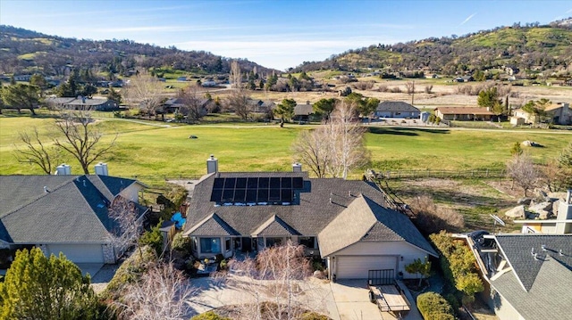 birds eye view of property with a mountain view