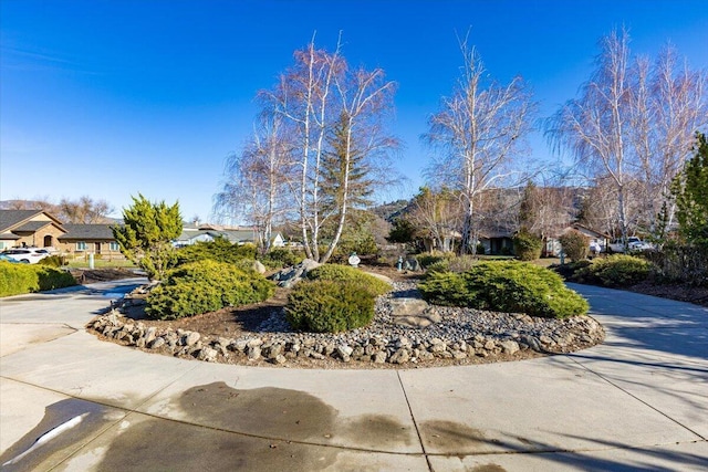 exterior space with driveway and a residential view