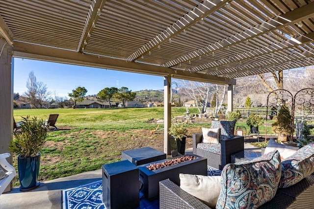 view of patio with a pergola and an outdoor living space with a fire pit