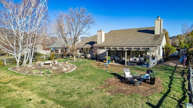 view of yard with a patio, an outdoor fire pit, and a pergola