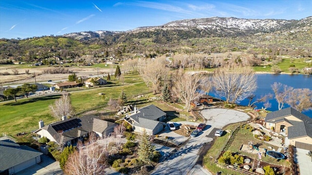 birds eye view of property with a residential view and a water and mountain view