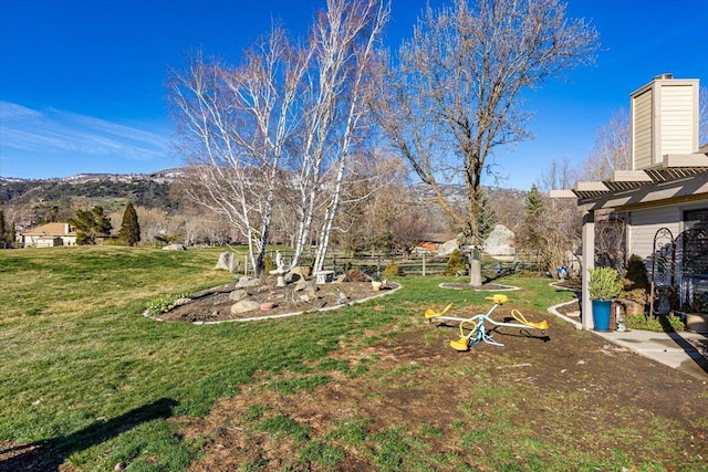 view of yard featuring a mountain view and a pergola