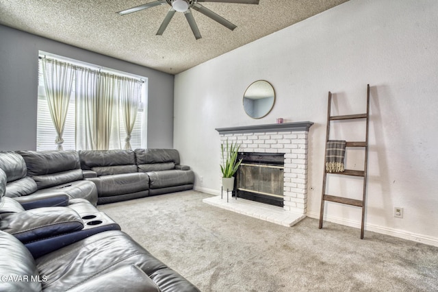 1027 James Ct, Lancaster, CA 93535 - living area featuring a ceiling fan, carpet floors, a fireplace, and a textured ceiling