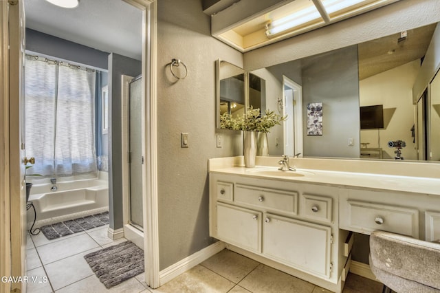 1027 James Ct, Lancaster, CA 93535 - bathroom featuring tile patterned floors, vanity, a textured wall, a shower stall, and a bath