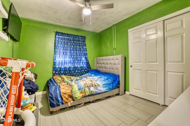 1027 James Ct, Lancaster, CA 93535 - bedroom featuring a textured wall, ceiling fan, and wood tiled floors